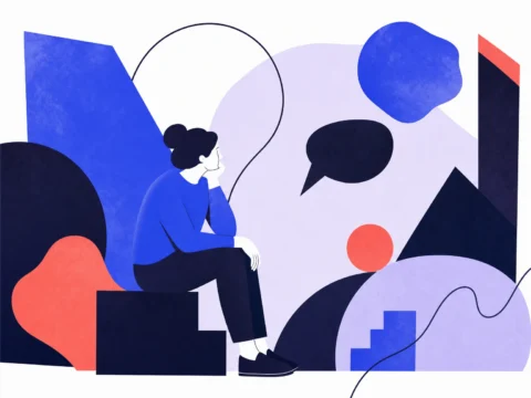Une personne assise, pensive, entourée de grandes formes abstraites, certaines arrondies, d’autres anguleuses.